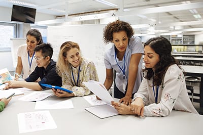 Teacher with a group of university students.